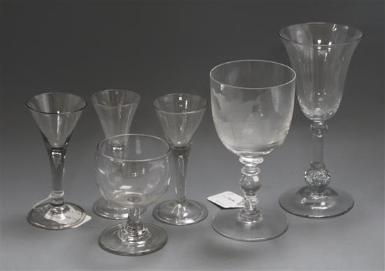 Three trumpet-shaped wine glasses, each with tear-drop stem and folded foot and three other glasses